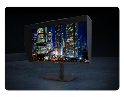 image of ProArt PA32UCXR display with background of illuminated skyscrapers at night